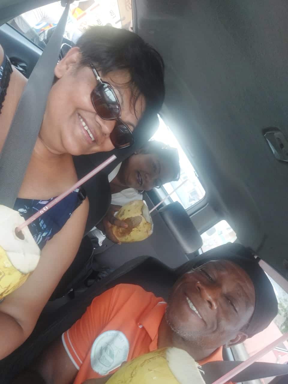 KEINO TWIN ISLE TOURS | Tobago Tourist Guide & 24hr Taxi Service – Keino Twin Isle Tours keino with a client smiling in the vehicle